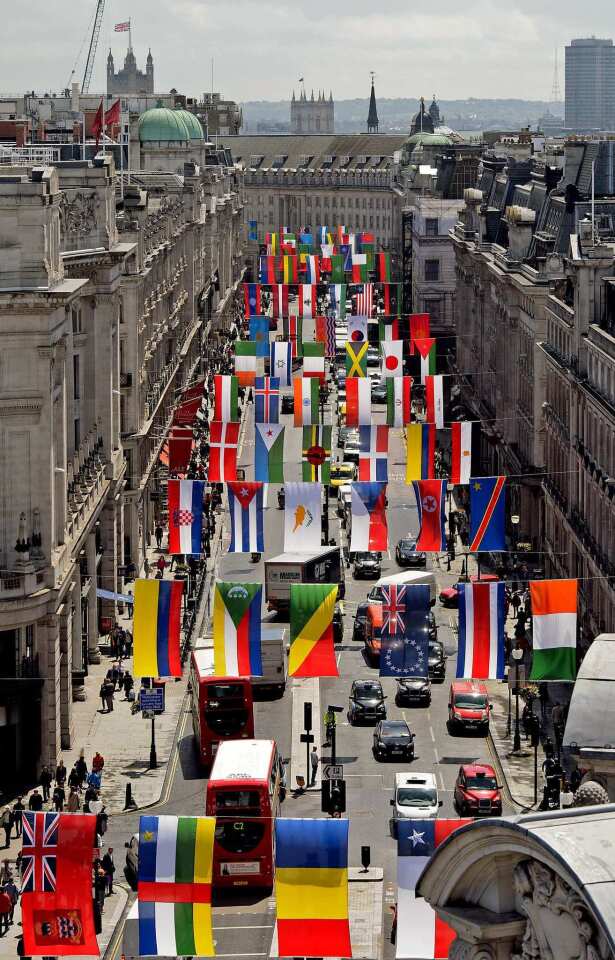 The national flags from countries participating in the London 2012 Olympic Games hang over Regent Street in central London.
