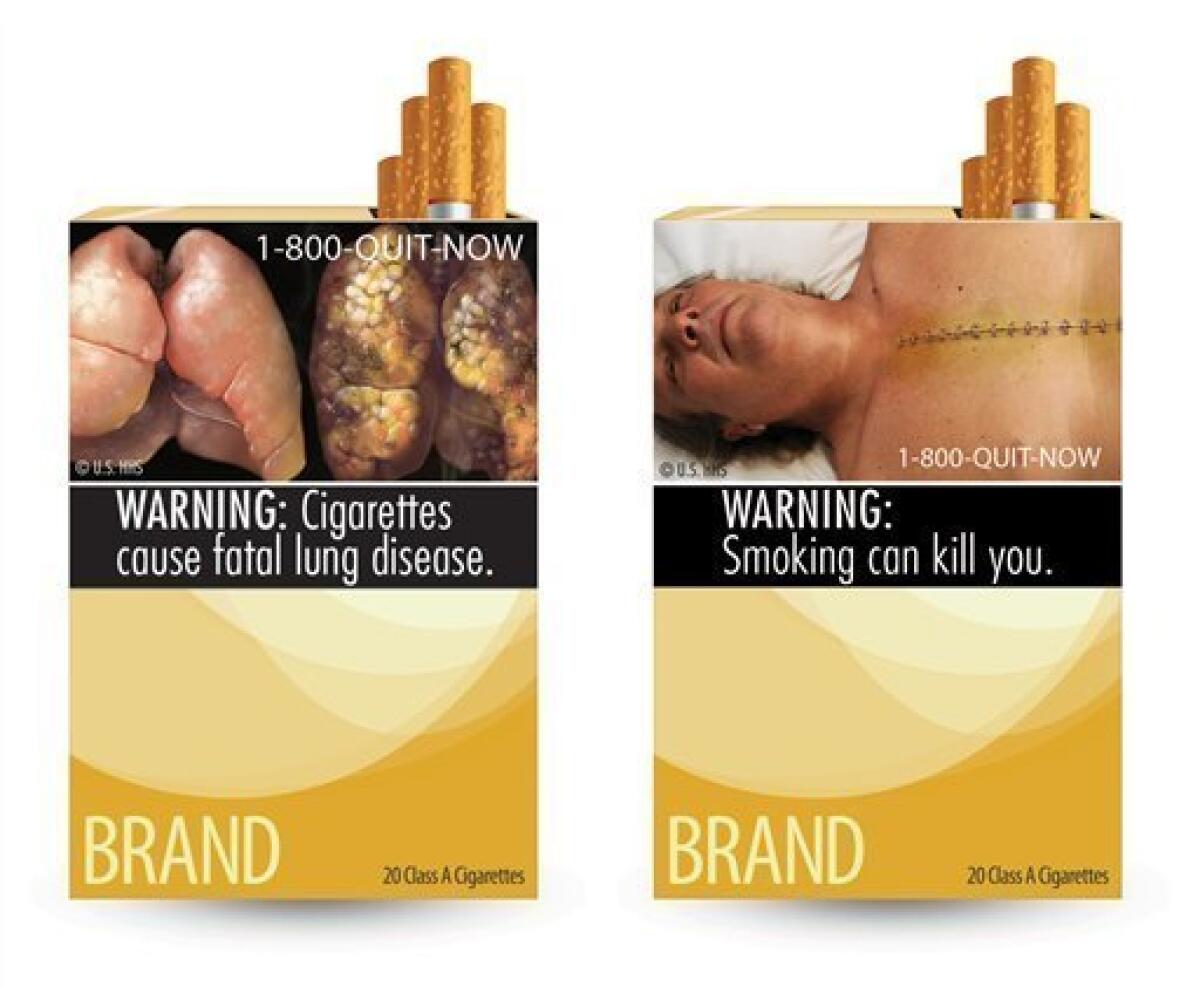 FILE - This file combination photo made from file images provided by the U.S. Food and Drug Administration shows two of nine cigarette warning labels from the FDA. On Tuesday, March 19, 2013, the U.S. government said it won’t appeal a court decision blocking it from requiring tobacco companies to put large graphic health warnings on cigarette packages. In a letter obtained by The Associated Press, Attorney General Eric Holder said that the Food and Drug Administration will go back to the drawi
