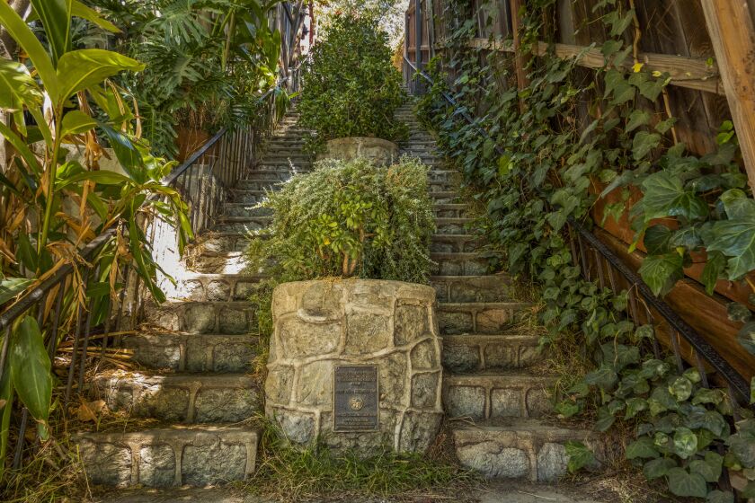 LOS ANGELES, CA - AUGUST 09: (14. BEACHWOOD CANYON WALK #34). The Saroyan Stairs were built of granite in 1923 and declared an historic cultural monument by the city of Los Angeles in 1991. The double-stairs connect Woodshire and Belden Drives in the Hollywoodland neighborhood of Los Angeles. Be warned that weekends and holidays require a parking permit to park in the neighorhood. Photographed on Tuesday, Aug. 9, 2022 in Los Angeles, CA. (Myung J. Chun / Los Angeles Times)