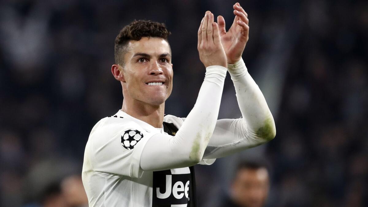 Juventus' Cristiano Ronaldo celebrates at the end of a match against Atletico Madrid on March 12.