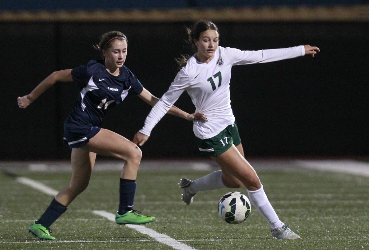 Lexi Magliarditi, right, shown here competing for Sage Hill School, helped the Newport Beach-based Slammers FC girls’ Under-18 team win the Elite Clubs National League national championship on Tuesday in Oceanside.