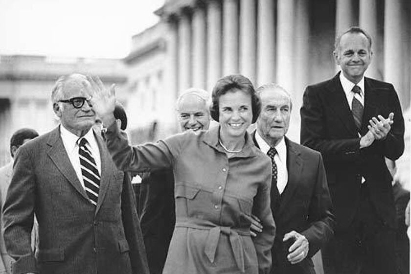 Sandra Day O'Connor waves as she arrives at the U.S. Capitol in Washington in Sept. 1981, shortly after her nomination to the Supreme Court is confirmed by the Senate. Walking behind O'Connor are, from left, Sen. Barry Goldwater, R-Ariz., Attorney General William French Smith, Sen. Strom Thurmond, R-S.C., who chairs the Senate Judiciary Committee, and Sen. Dennis DeConcini, D-Ariz.