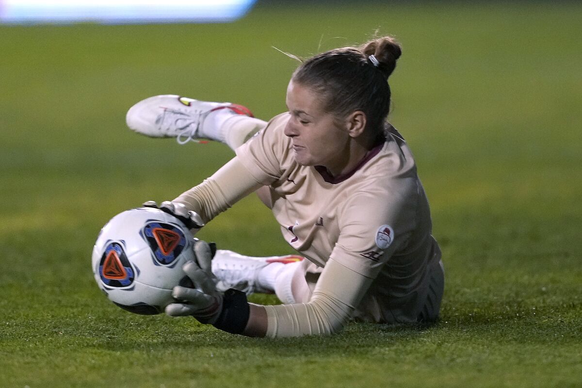 Florida State goalkeeper Cristina Roque (1) makes a save on a kick by BYU during the second half of the NCAA College Cup women's soccer final, Monday, Dec. 6, 2021, in Santa Clara, Calif. (AP Photo/Tony Avelar)