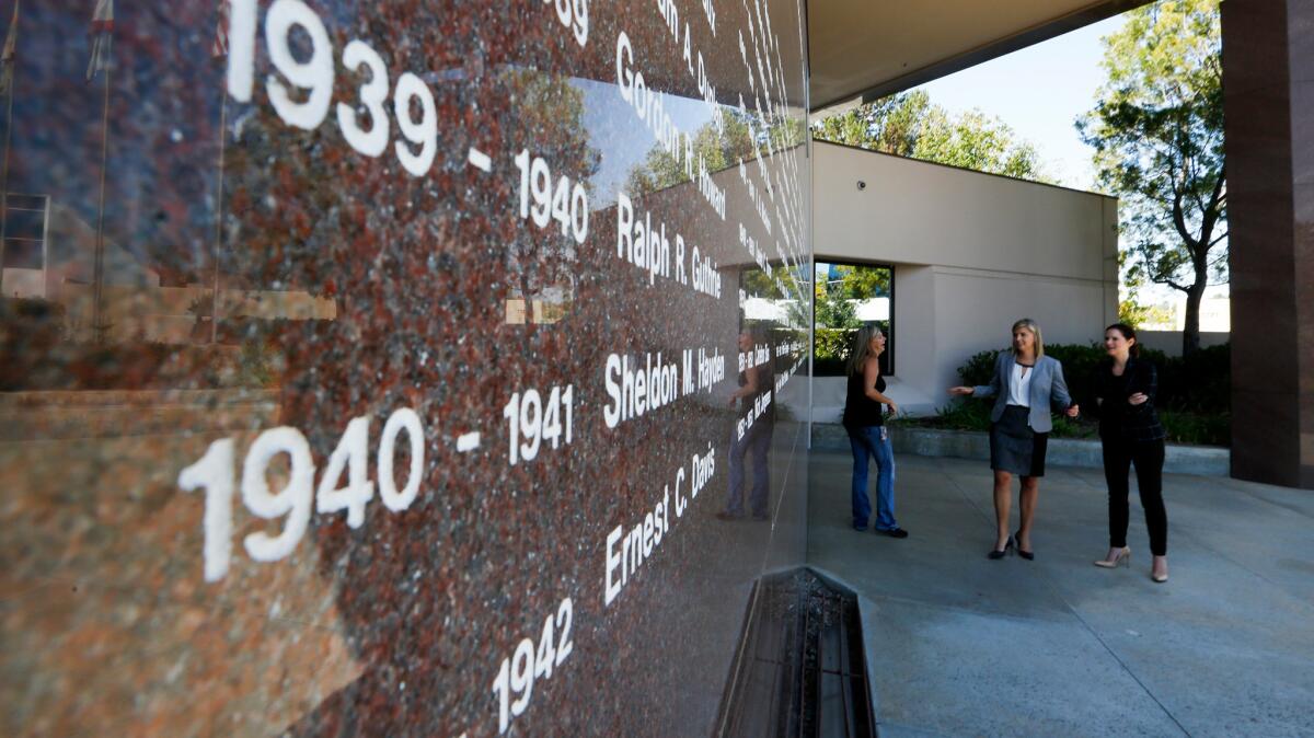 The names of past Toastmasters presidents are etched in a granite wall outside the organization's headquarters in Rancho Santa Margarita.