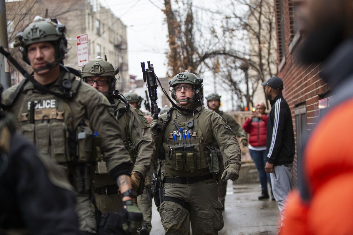 Police arrive at the scene Tuesday in Jersey City, N.J. 
