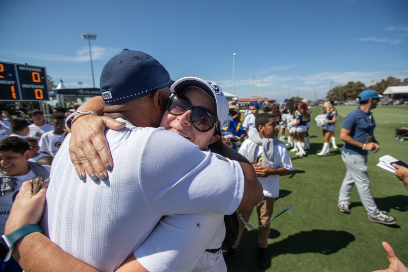 Molly Higgins is greeted at training camp in Irvine.