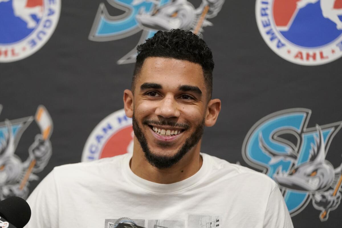 San Jose Barracuda's Evander Kane smiles while speaking at a news conference after a hockey practice in San Jose, Calif., Tuesday, Nov. 30, 2021. Kane reported to the San Jose Sharks' minor league affiliate for the first time since serving a suspension for submitting a fake COVID-19 vaccination card. (AP Photo/Jeff Chiu)
