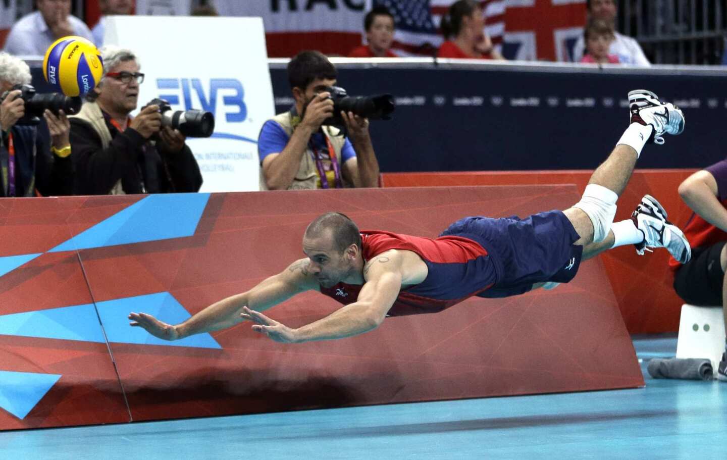 Team USA's Donald Suxho dives but cannot reach the ball during a quarterfinal loss to Italy.