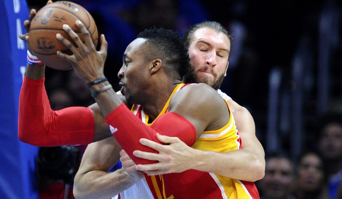 Clippers center Spencer Hawes defends Rockets center Dwight Howard in Game 4.