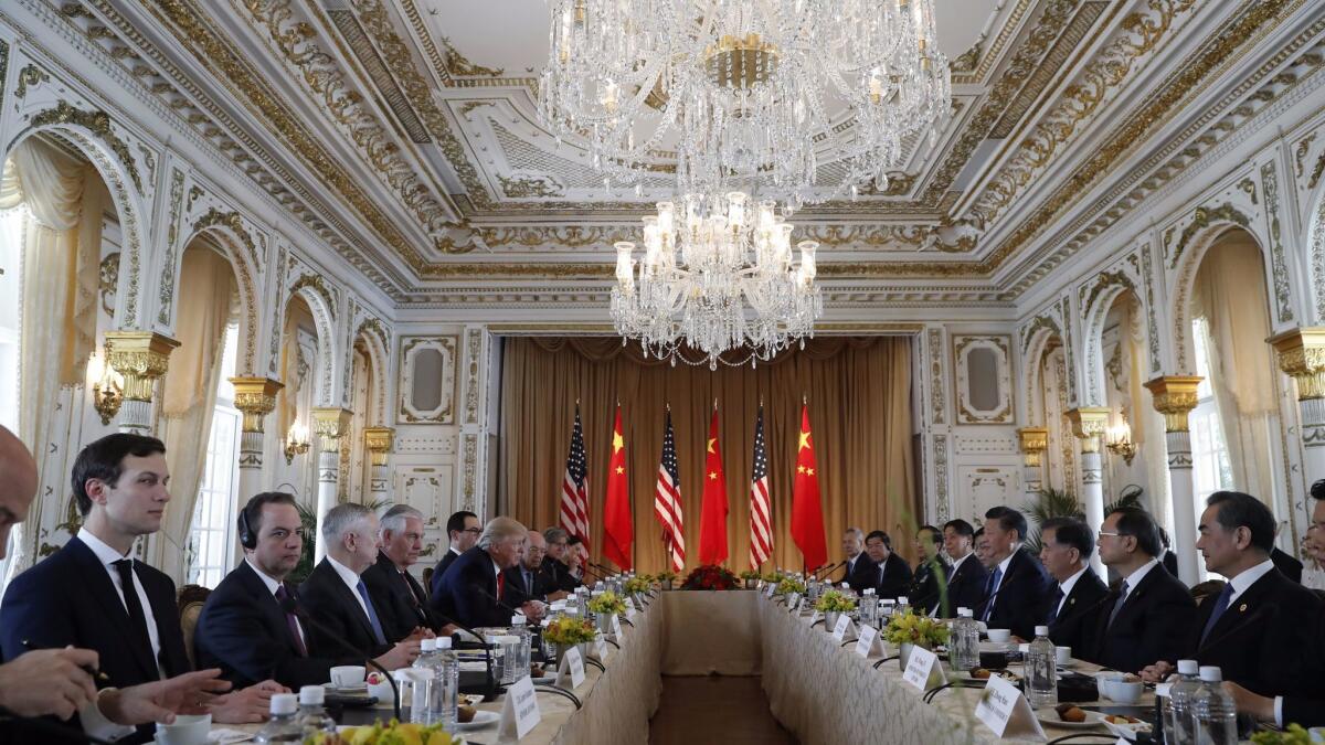 President Trump, left, hosted Chinese President Xi Jinping, right, for a two-day summit at his Mar-a-Lago resort in April. (Alex Brandon / Associated Press)
