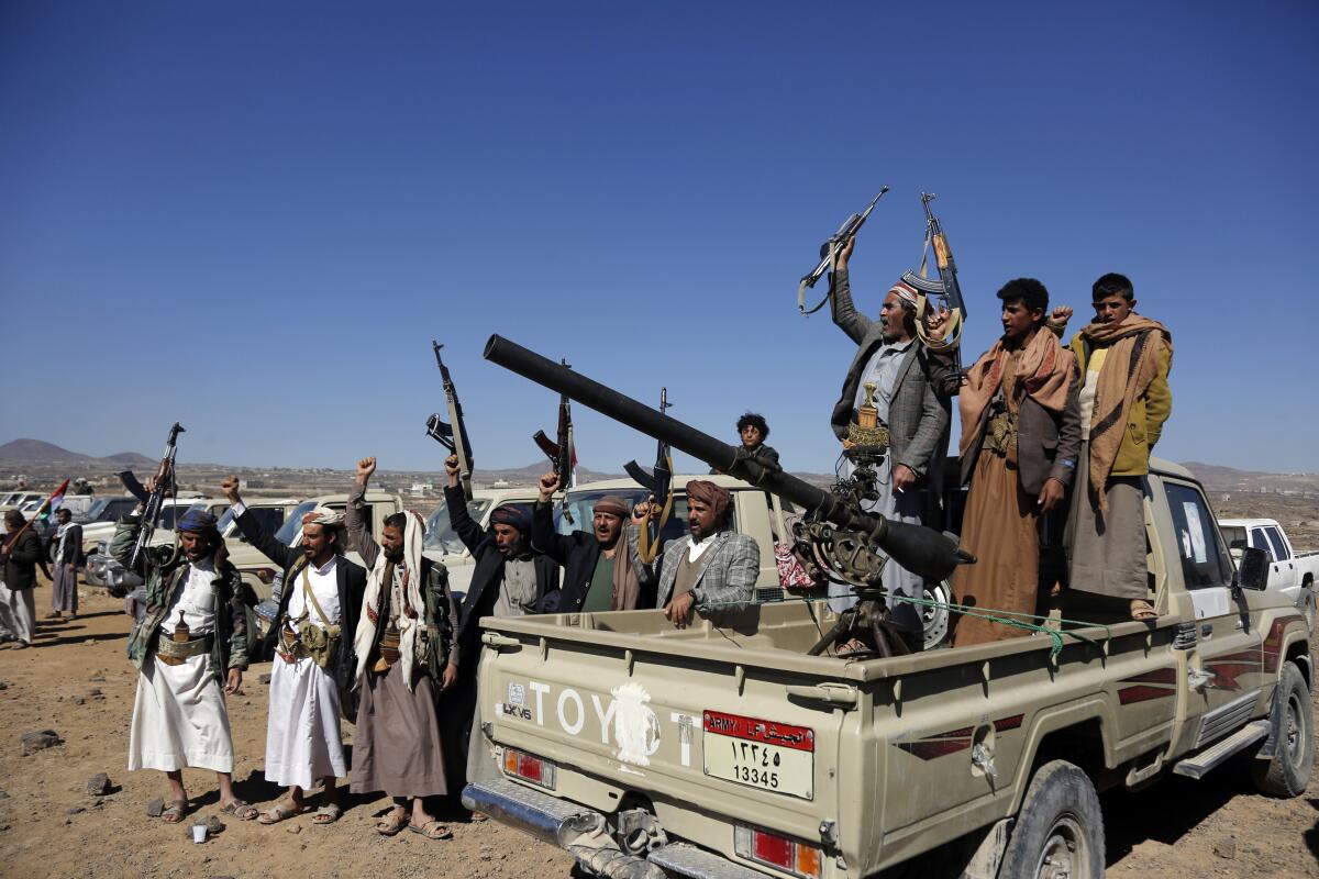 Houthi fighters and tribesmen rallying against the U.S. and U.K.