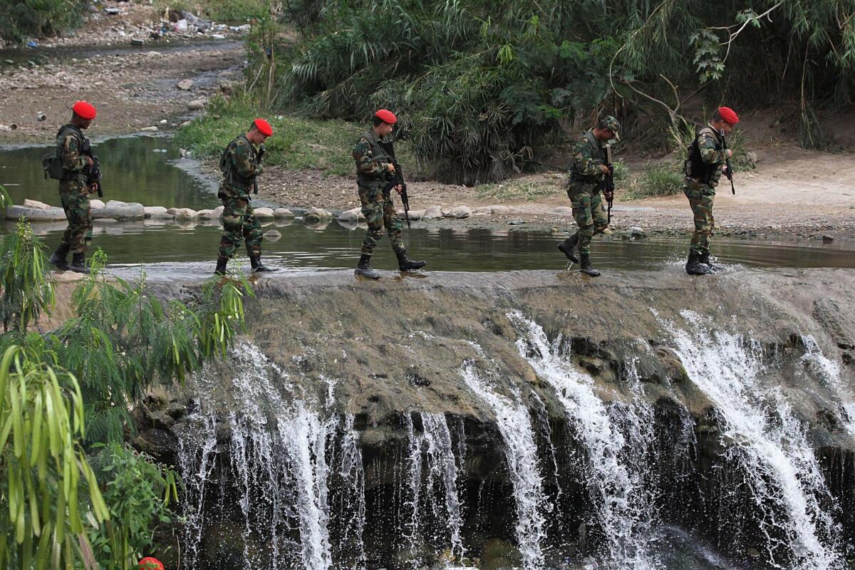 Venezuelan troops patrol a checkpoint in San Antonio, Tachira state, which is near the border with Colombia, on Sunday.