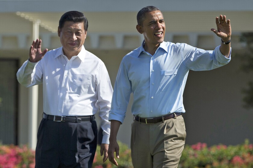President Barack Obama and Chinese President Xi Jinping walk at the Annenberg Retreat of the Sunnylands estate in Rancho Mirage, Calif., where they met to discuss future relations.