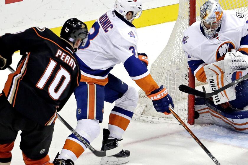 Right wing Corey Perry slips a shot past Islanders goalie Thomas Greiss in the second period for the Ducks' only score Friday night.