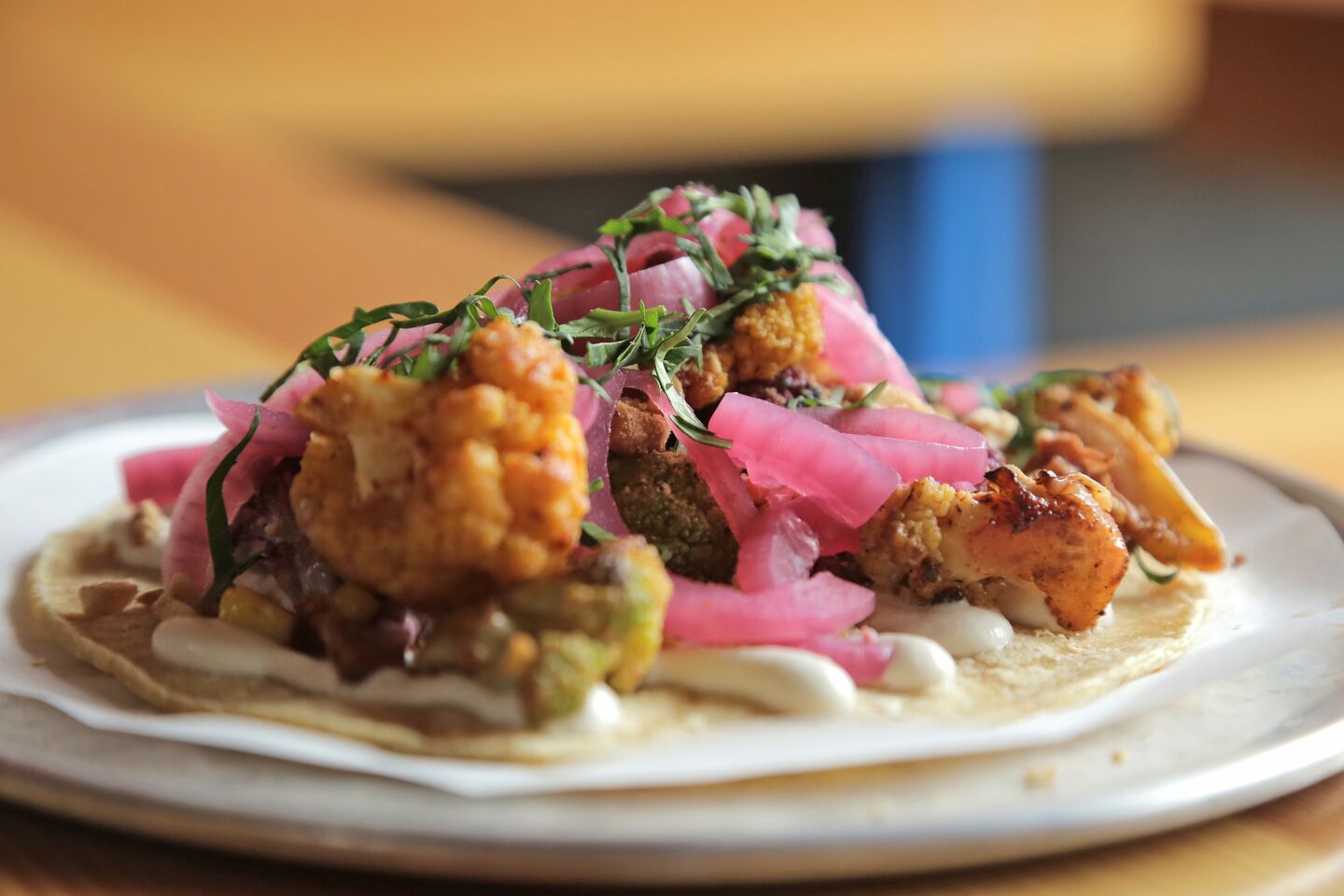 The rainbow cauliflower taco with grilled corn and cashew puree is a vegan-friendly menu item at Trejo's Cantina in Hollywood.