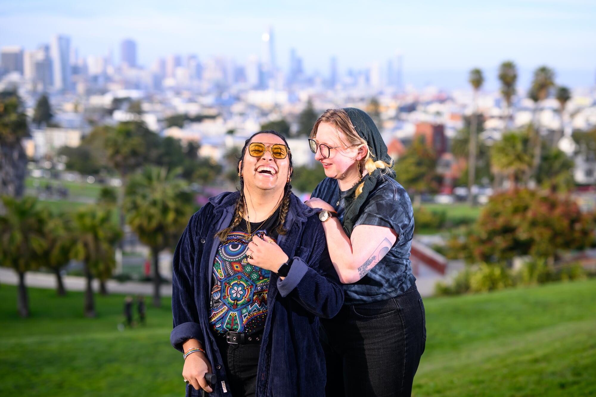 Queer activists Elio Hawk Garcia, left, and Evan Johnson at Delores Park in San Francisco.