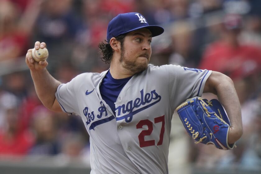 Los Angeles Dodgers starting pitcher Trevor Bauer (27) delivers in the first inning of a baseball game against the Atlanta Braves on Sunday, June 6, 2021, in Atlanta. (AP Photo/Brynn Anderson)