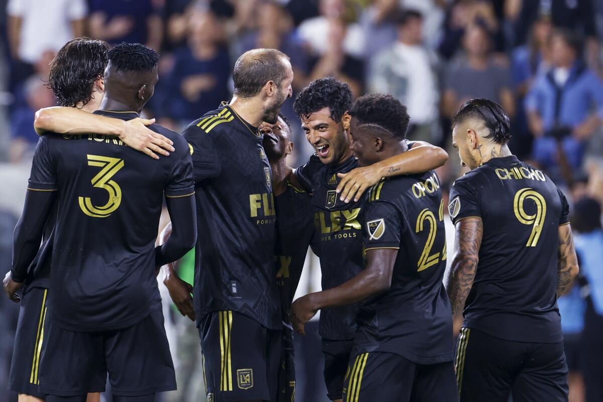Los Angeles FC forward Carlos Vela, third from right, celebrates his goal with teammates.