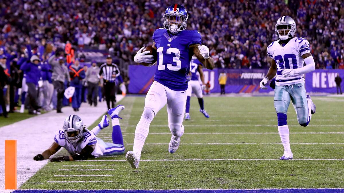 Giants receiver Odell Beckham Jr. (13) scores against the Cowboys on a 61-yard touchdown pass play during the third quarter Sunday night.
