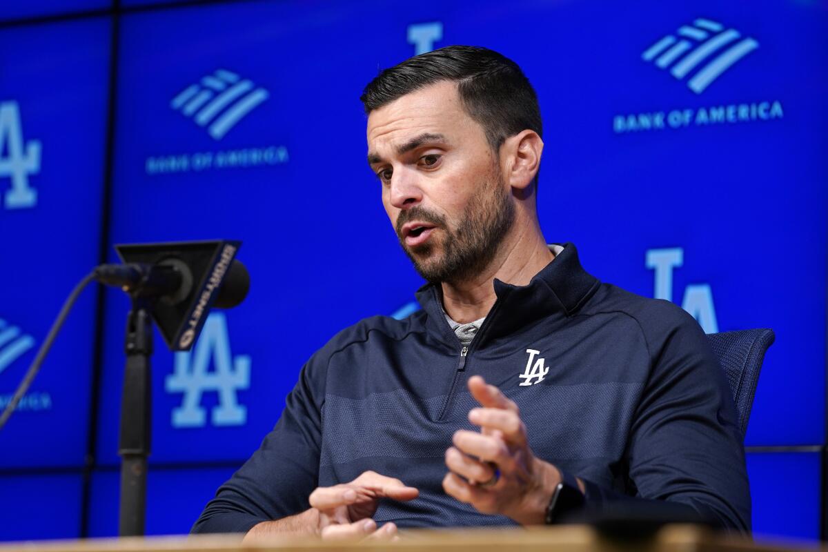 Dodgers general manager Brandon Gomes speaks during a news conference.