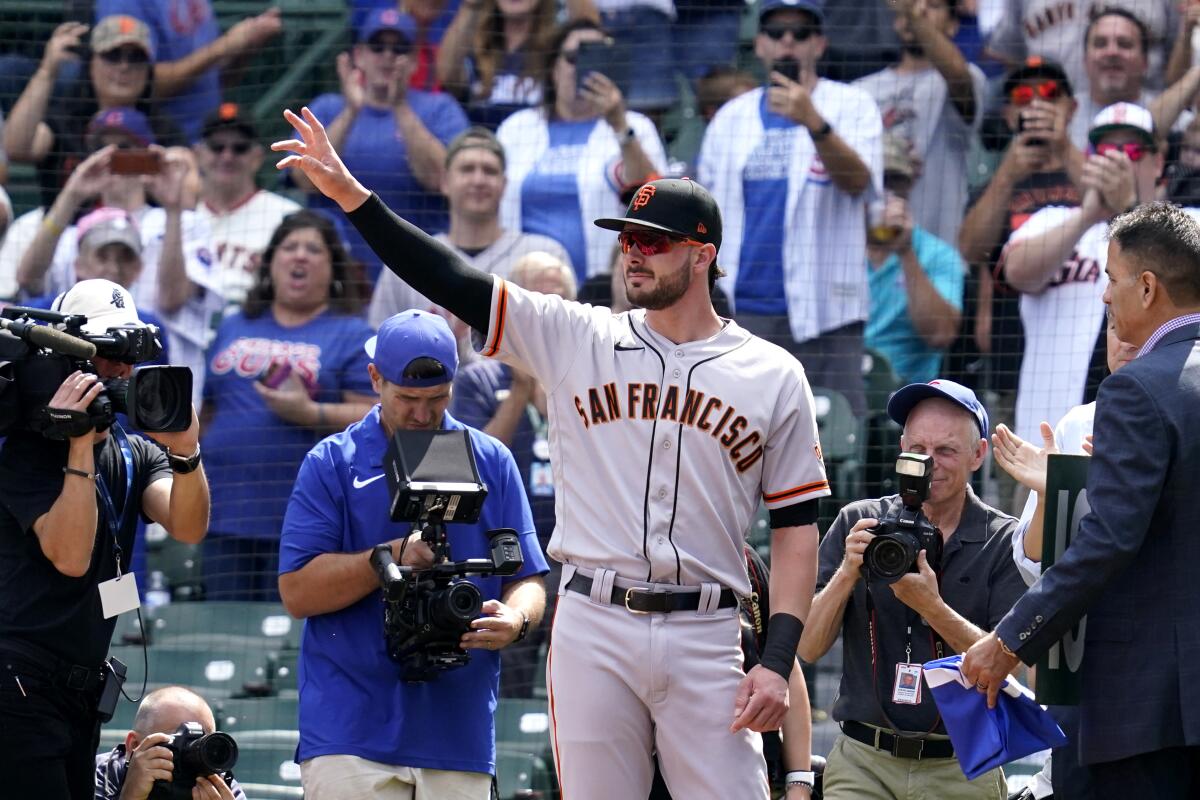 San Francisco Giants' Kris Bryant greets Chicago Cubs fans before a baseball game in Chicago, Friday, Sept. 10, 2021. (AP Photo/Nam Y. Huh)