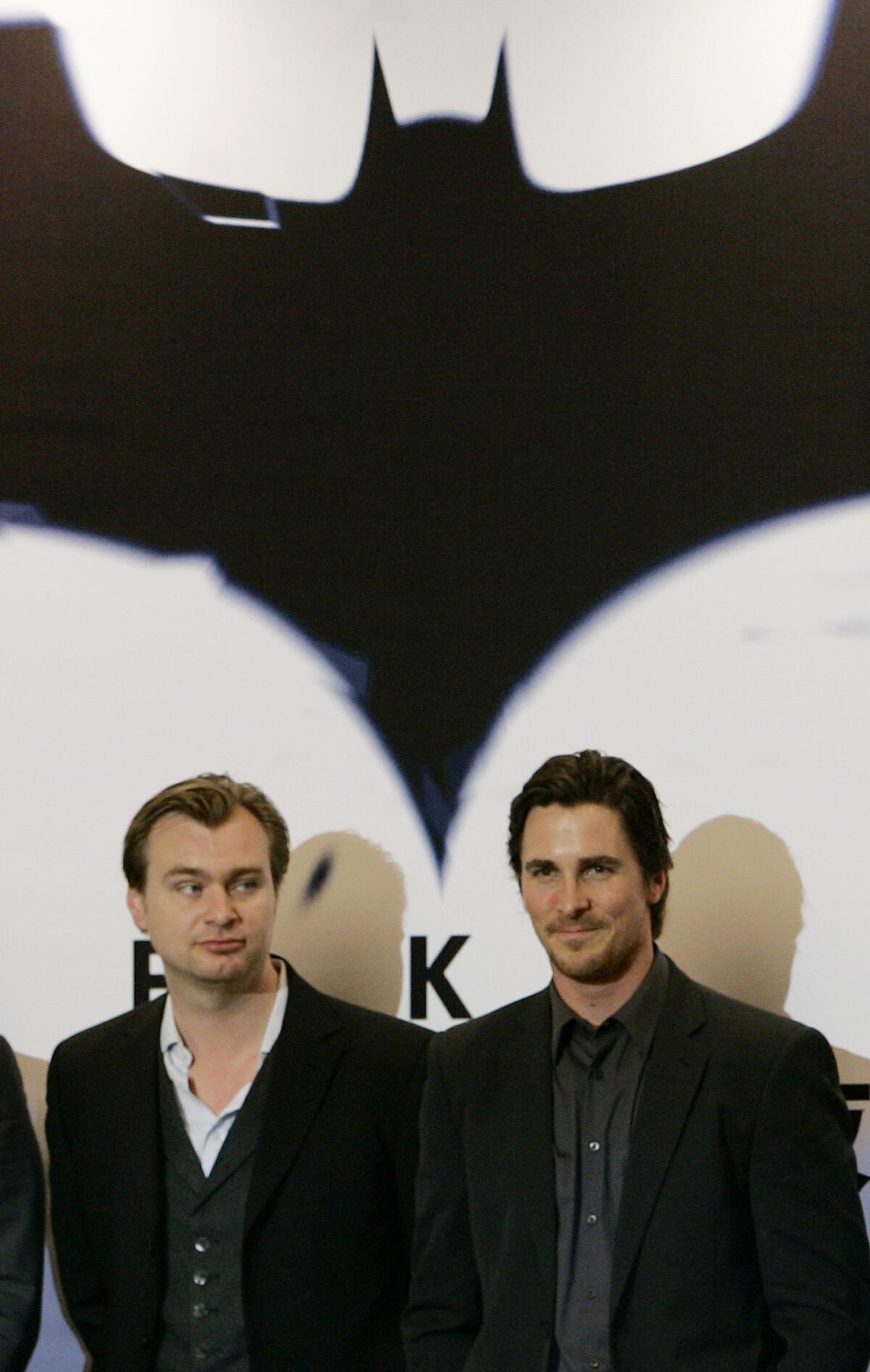 Actor Christian Bale, right, and director Christopher Nolan pose during a news conference for "The Dark Knight" in Hong Kong.