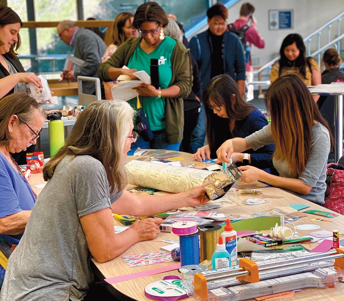 Participants in UC San Diego's Geisel Library celebration of World Bookmark Day, Feb. 25, 2020 create their own bookmarks.