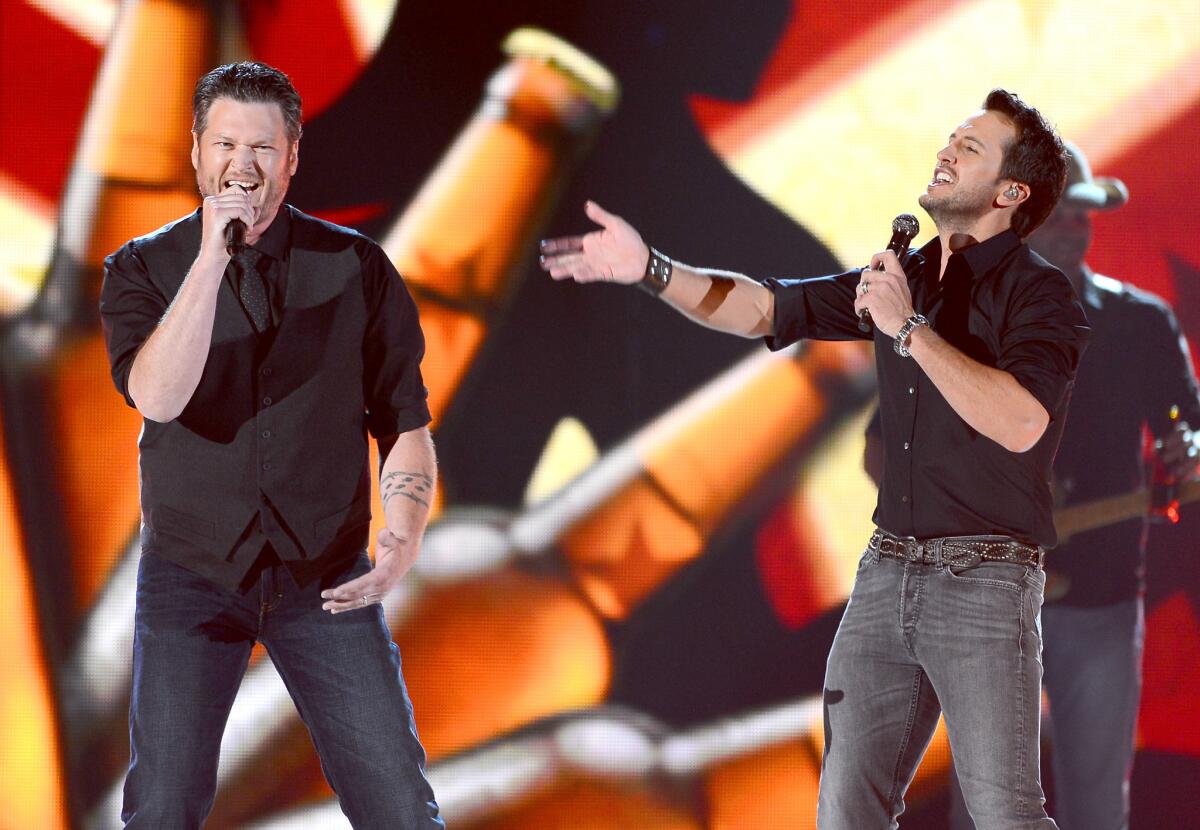 Last year's hosts Blake Shelton, left, and Luke Bryan are set to again lead the awards show April 6, part of a weeklong salute to country music.