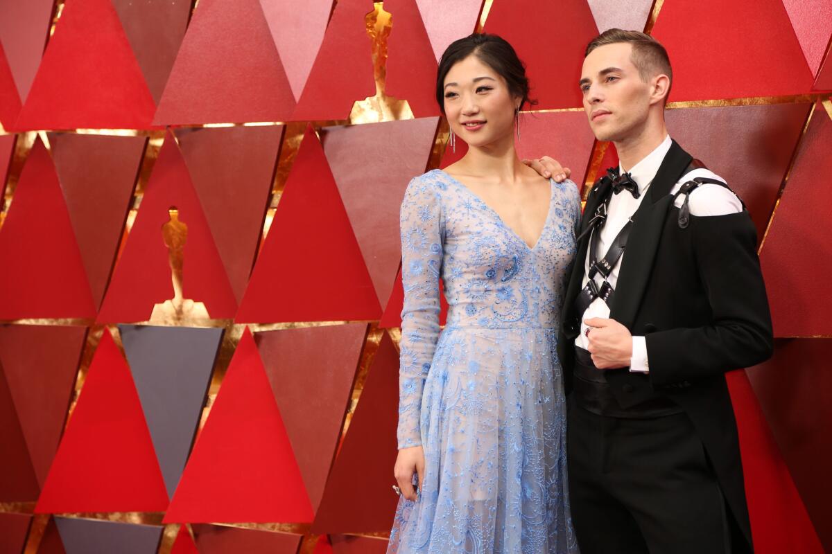 Mirai Nagasu, left, and Adam Rippon during the arrivals at the 90th Academy Awards.