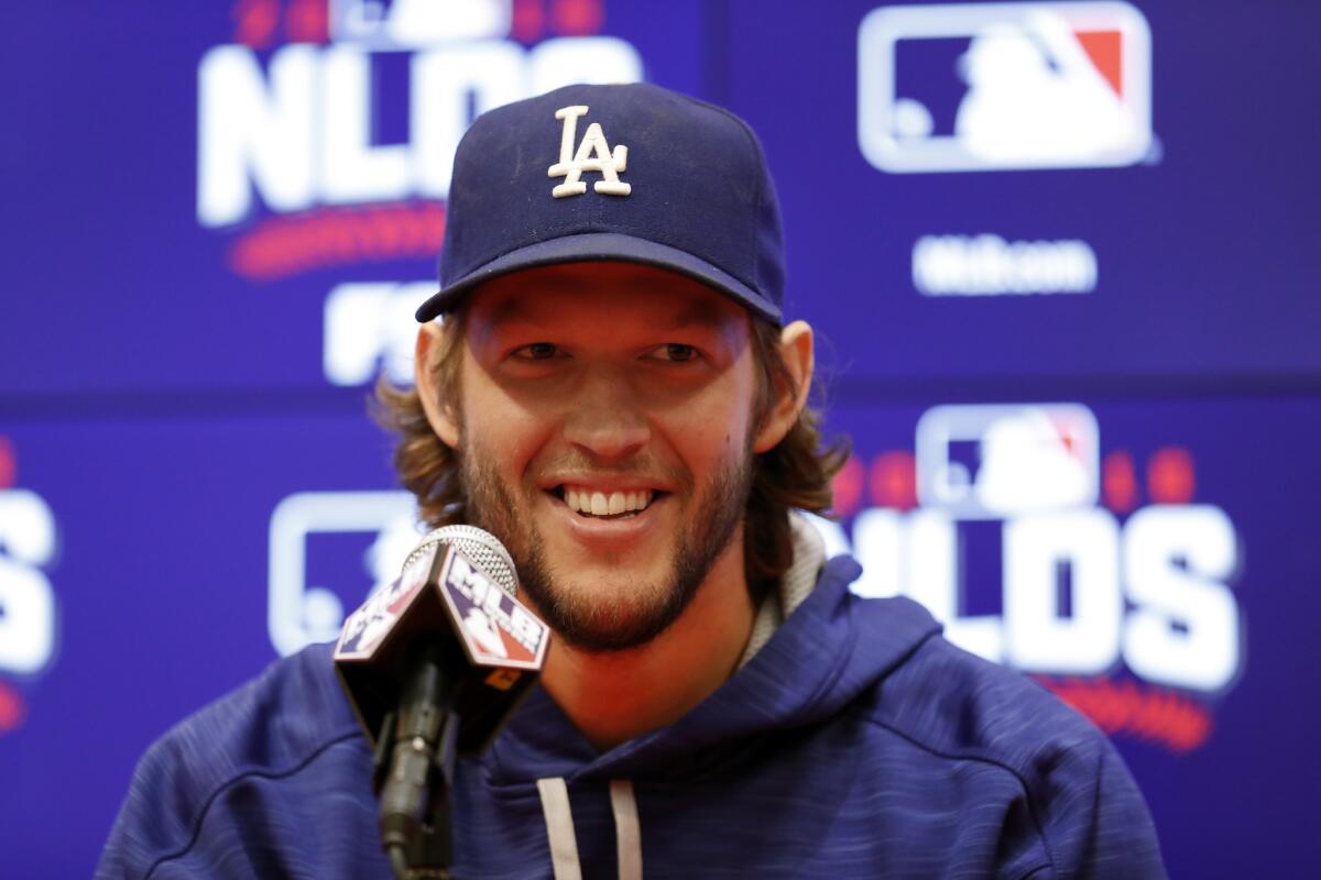 Dodgers starting pitcher Clayton Kershaw smiles during a news conference before baseball batting practice at Nationals Park on Oct. 6.