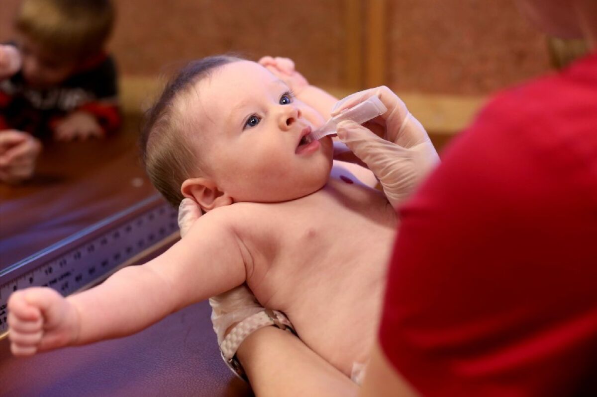 Doctors say they feel enormous pressure from some parents to delay vaccines for their children even though such delays can make kids more vulnerable to life-threatening diseases, a new study finds. This 6-month-old baby receives an oral vaccine in Salem, Ore.