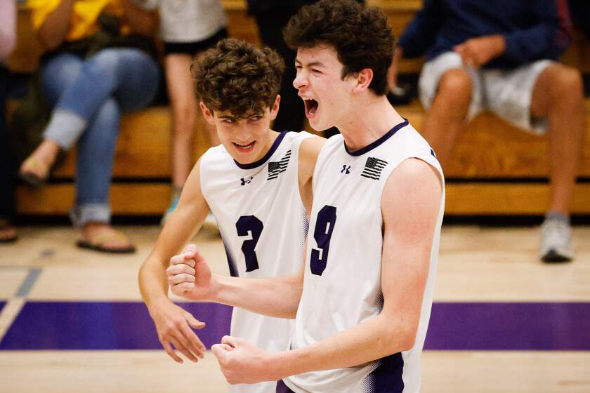 Carlsbad, CA - May 14: Carlsbad's Boston Kunz and Parker Tomkinson celebrate after beating Del Norte during the Division 2 Southern California regional playoff game at Carlsbad High School on Tuesday, May 14, 2024 in Carlsbad, CA. (Meg McLaughlin / The San Diego Union-Tribune)