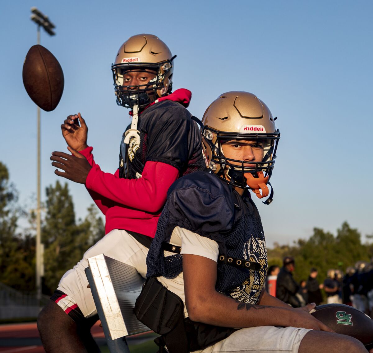 Mater Dei Catholic High School receiver Jerry McClure (left) and quarterback Dominic Nankil have a strong bond.