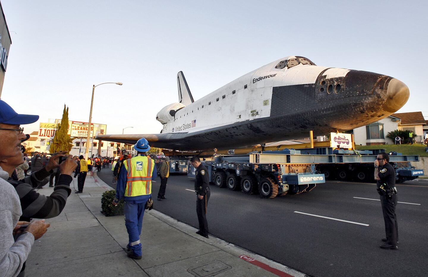 The Space Shuttle Endeavour began its second day of its last trek to the California Science Center on Manchester Blvd. in Inglewood on Saturday, Oct. 13, 2012. Thousands cheered and the 2001: A Space Odyssey theme song played on loud speakers as Endeavour arrived at the Forum. (Raul Roa/Staff Photographer)