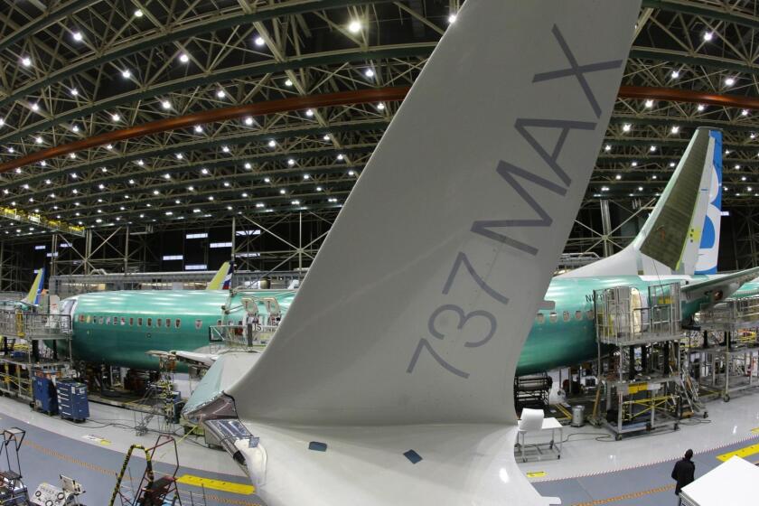 In this Monday, Dec. 7, 2015, photo, taken with a fisheye lens, the distinctive winglet on the second Boeing 737 MAX airplane being built is shown on the assembly line in Renton, Wash. On Thursday, March 3, 2016, the Commerce Department reports on U.S. factory orders for January. (AP Photo/Ted S. Warren)