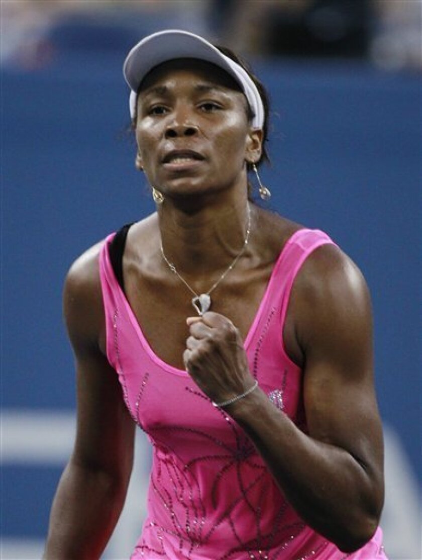 Venus Williams, of the United States, reacts during a quarterfinal against Francesca Schiavone, of Italy, at the U.S. Open tennis tournament in New York, Tuesday, Sept. 7, 2010. (AP Photo/Charles Krupa)
