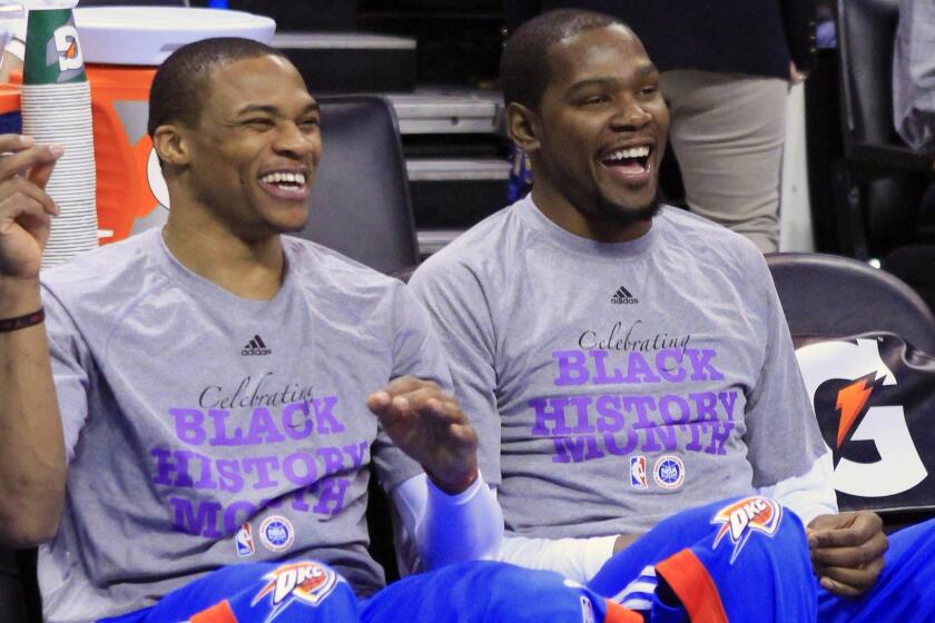 Oklahoma City Thunder guard Russell Westbrook, left, and forward Kevin Durant, right, laugh before the start of a game against the New Orleans Pelicans on Feb. 6. Have injuries masked Oklahoma City's competitiveness?