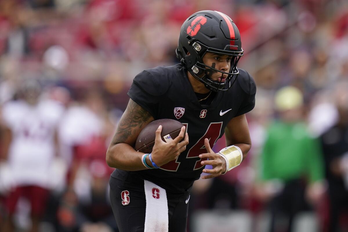 Stanford quarterback Ashton Daniels carries the ball on a touchdown scramble.