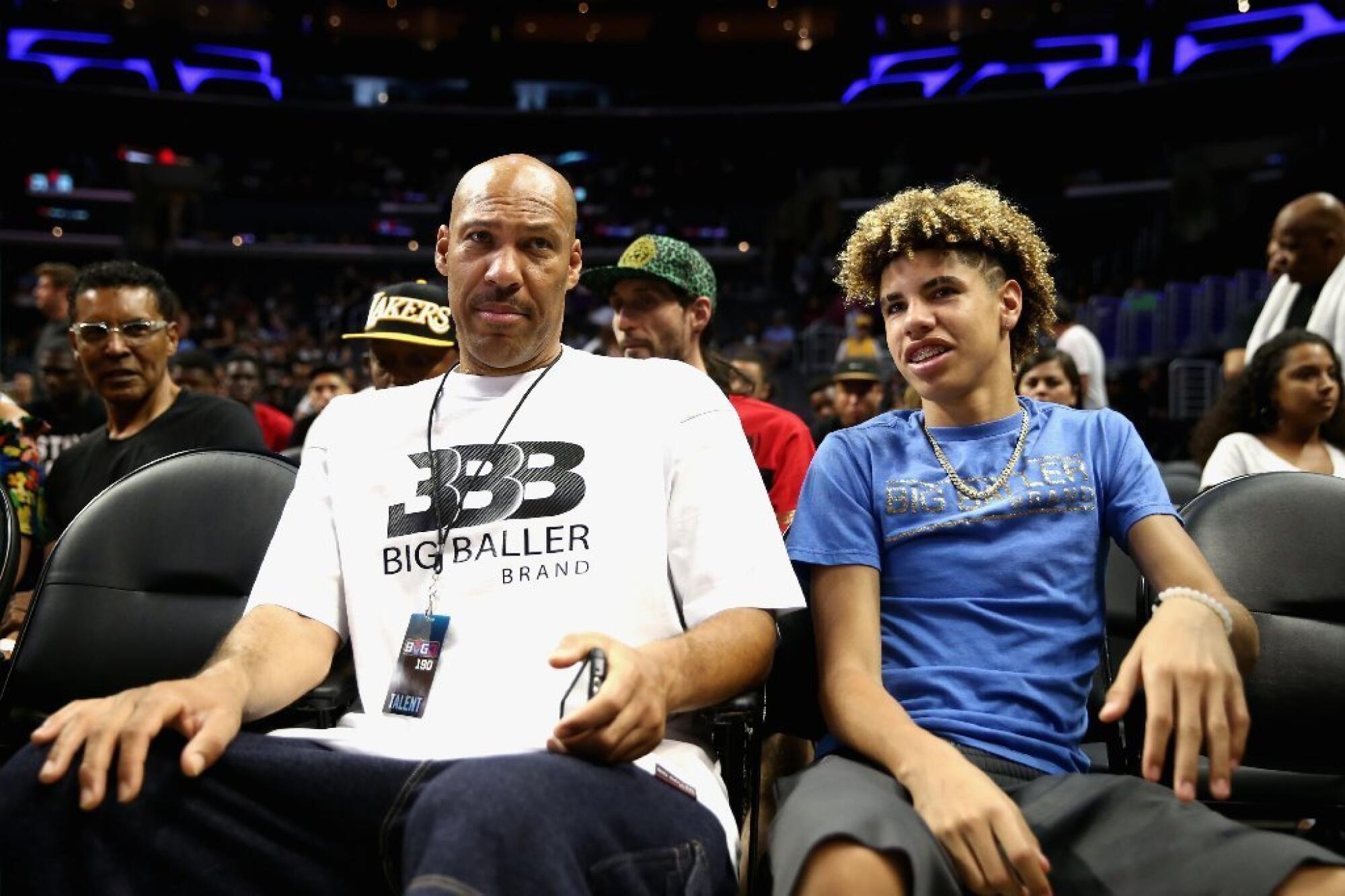 LaVar Ball and son LaMelo look on from the crowd during a BIG3 game at Staples Center.
