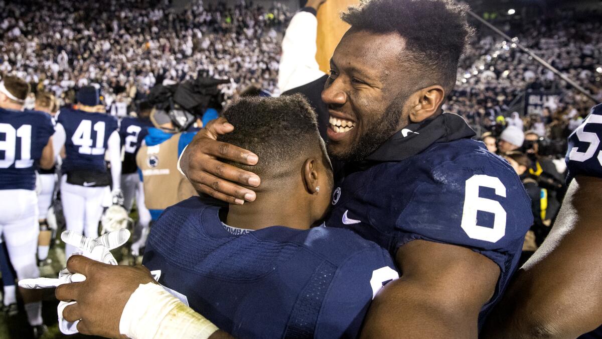 Penn State safety Malik Golden (6), shown celebrating with teammate Mark Allen after defeating Michigan State for the Big Ten title, is among the last players on the roster who committed to play for the school when Joe Paterno was coach.