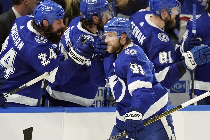 Tampa Bay Lightning center Steven Stamkos (91) celebrates with the bench after his goal.