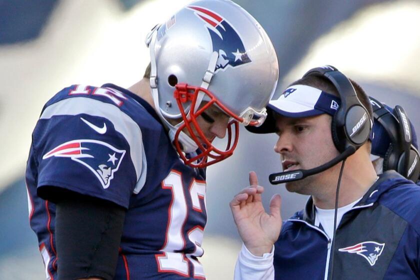 FILE - In this Dec. 4, 2016, file photo, New England Patriots quarterback Tom Brady (12) confers with offensive coordinator Josh McDaniels during the first half of an NFL football game against the Los Angeles Rams in Foxborough, Mass. The Indianapolis Colts announced Tuesday, Feb. 6, 2018, that hey have hired Josh McDaniels as their new head coach. (AP Photo/Elise Amendola, File)