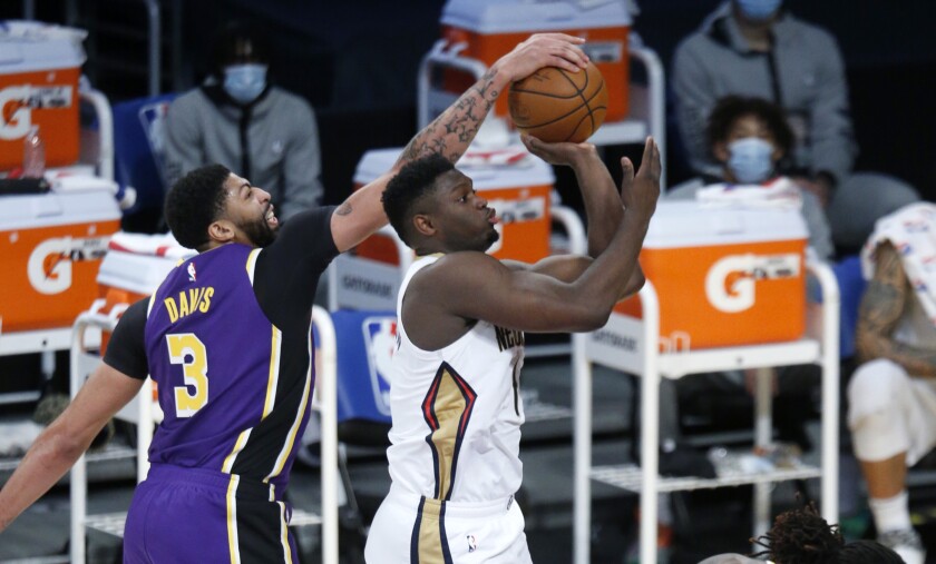 Lakers forward Anthony Davis blocks a shot by New Orleans Pelicans forward Zion Williamson.