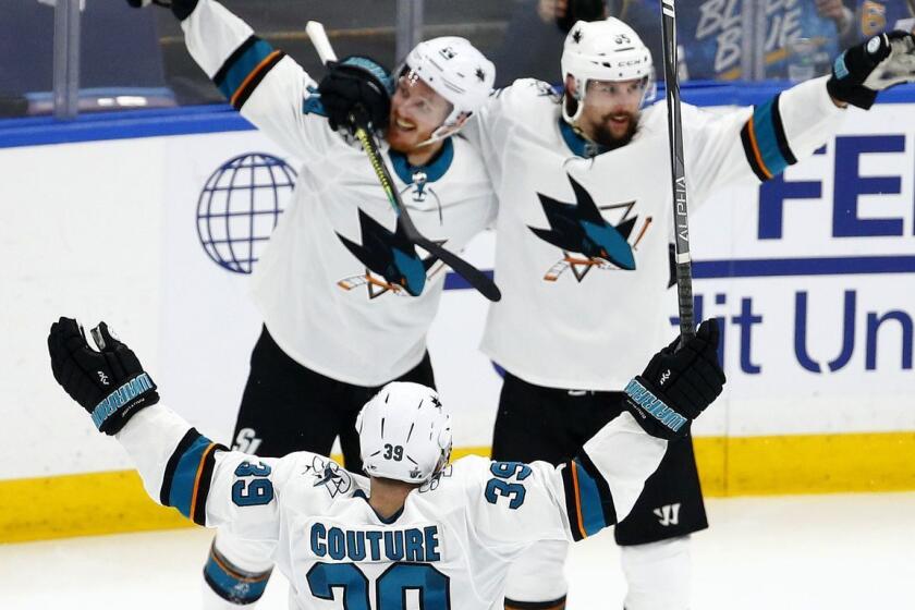 ST LOUIS, MISSOURI - MAY 15: Erik Karlsson #65 of the San Jose Sharks celebrates with his teammates after scoring the game winning goal in overtime to defeat the St. Louis Blues in Game Three of the Western Conference Finals during the 2019 NHL Stanley Cup Playoffs at Enterprise Center on May 15, 2019 in St Louis, Missouri. (Photo by Dilip Vishwanat/Getty Images) ** OUTS - ELSENT, FPG, CM - OUTS * NM, PH, VA if sourced by CT, LA or MoD **