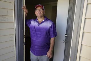 Rolando José Cisneros Borroto in his apartment, Friday, Aug. 26, 2022, in Algona, Iowa. (AP Photo/Charlie Neibergall)