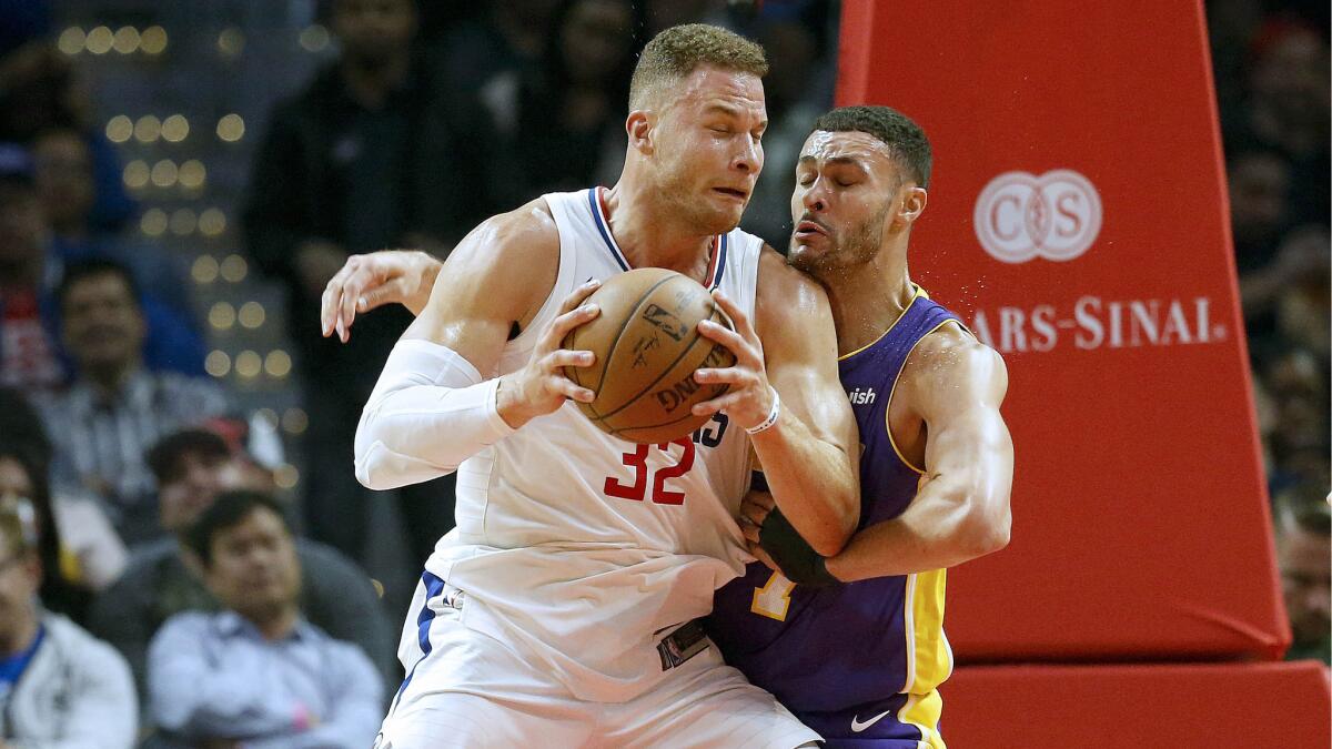 Clippers forward Blake Griffin battles Lakers forward Larry Nance Jr. for position at Staples Center on Nov. 27.