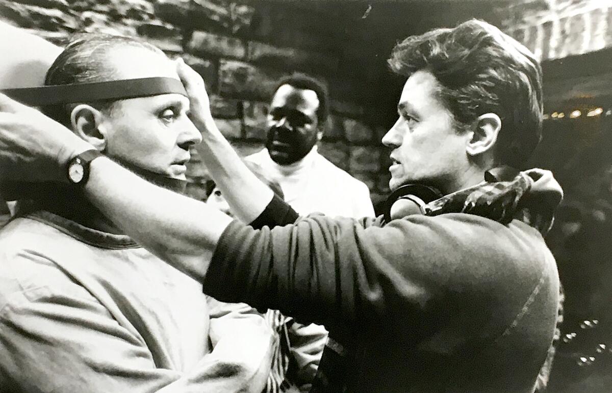 Jonathan Demme, right, directs Anthony Hopkins on the set of "Silence of the Lambs" in 1990. (Ken Regan / Orion Pictures)