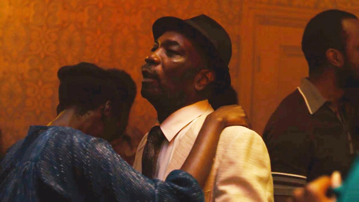 Dennis Bovell dances with a partner in a cameo appearance in  "Lovers Rock."