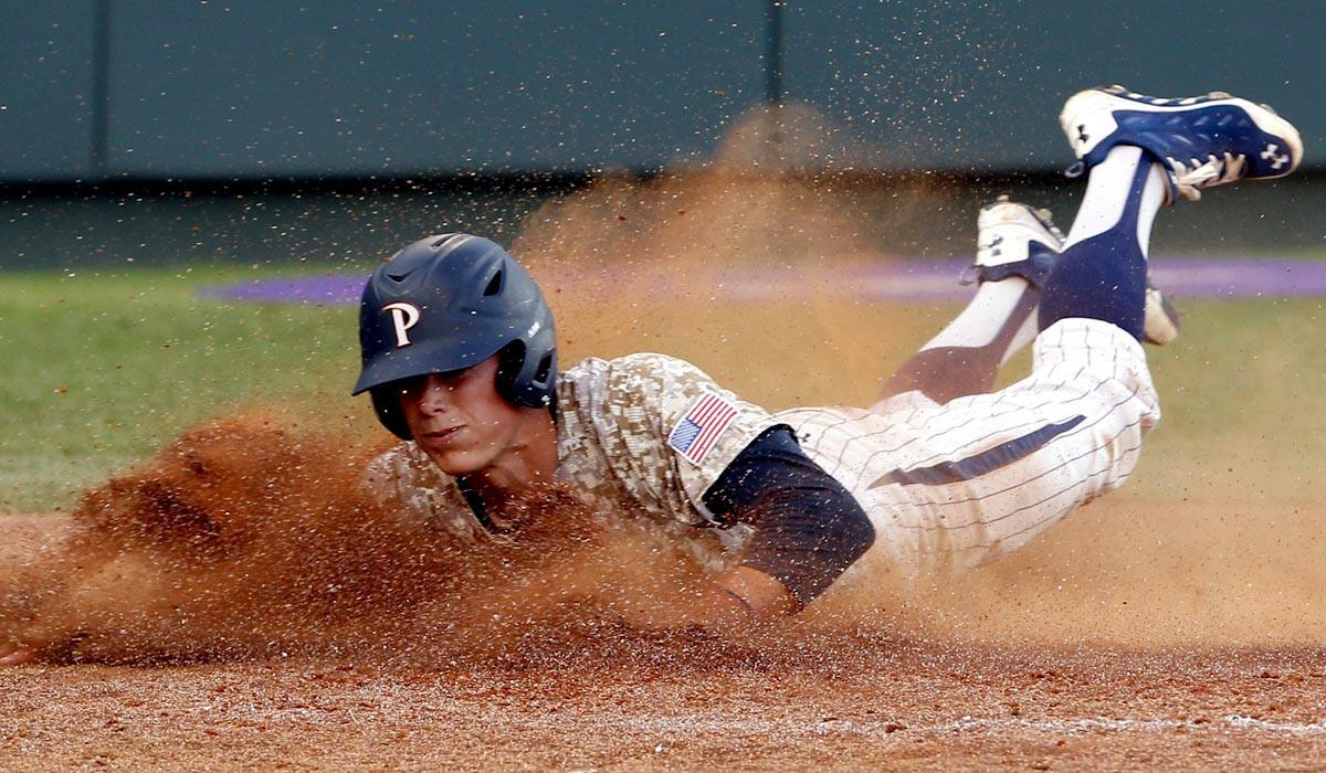 Pepperdine's Hutton Moyer slides home safely after a sacrifice fly by Manny Jefferson in the seventh inning against Texas Christian on Sunday.