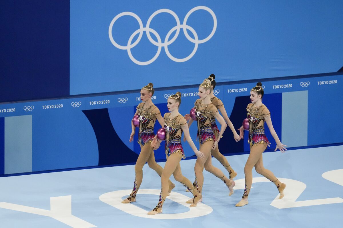 Russian Olympic Committee's rhythmic gymnastics' team performs during the rhythmic gymnastics group all-around final at the 2020 Summer Olympics, Sunday, Aug. 8, 2021, in Tokyo, Japan. (AP Photo/Ashley Landis)